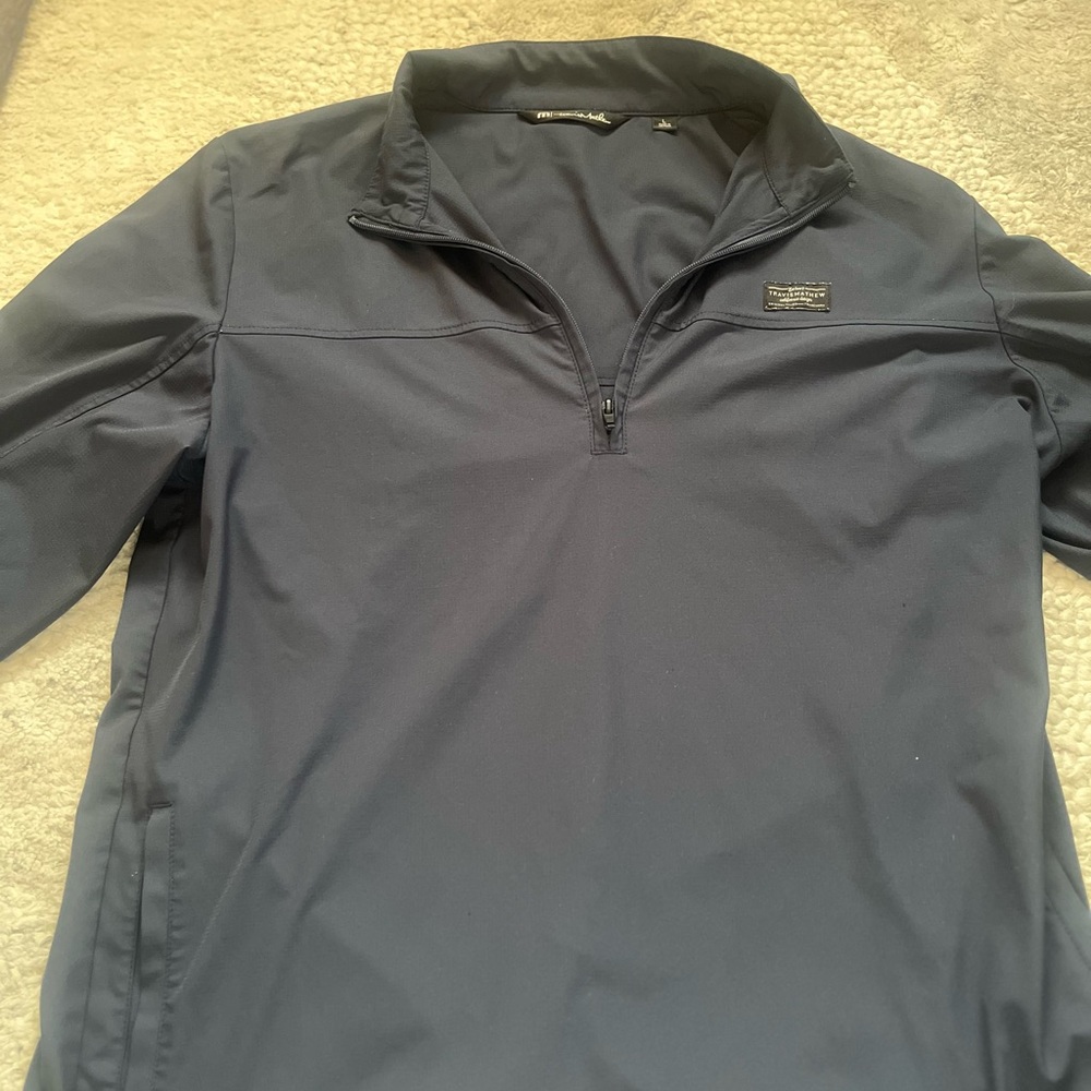Blue Travis Mathew quarter zip. In good condition size large.